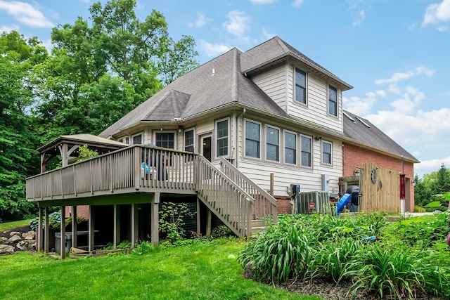 1554 Hanover Rd, Delaware, OH 43015 - back of property with a wooden deck, a yard, stairway, and roof with shingles