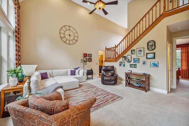 1554 Hanover Rd, Delaware, OH 43015 - living area with high vaulted ceiling, a ceiling fan, carpet flooring, and stairs