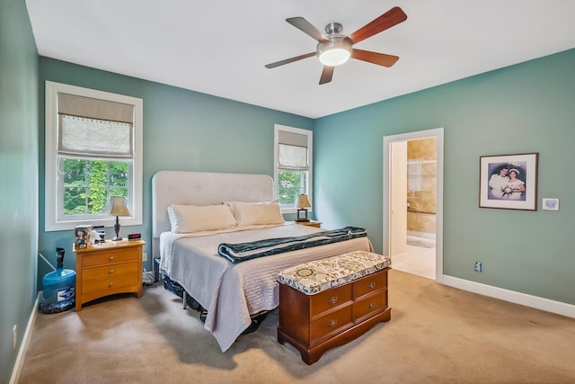 1554 Hanover Rd, Delaware, OH 43015 - bedroom featuring light carpet, connected bathroom, and a ceiling fan