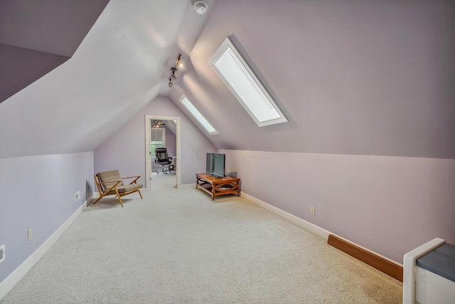 1554 Hanover Rd, Delaware, OH 43015 - living area featuring a skylight, lofted ceiling, and carpet flooring