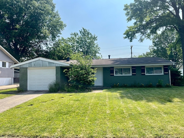 332 Baroness Way, Columbus, OH 43230 - ranch-style house with brick siding, a front lawn, asphalt driveway, and a detached garage