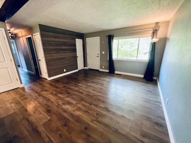 332 Baroness Way, Columbus, OH 43230 - unfurnished room featuring a textured ceiling and dark wood-type flooring