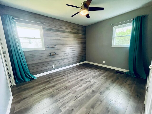 332 Baroness Way, Columbus, OH 43230 - spare room with wooden walls, wood finished floors, and a ceiling fan