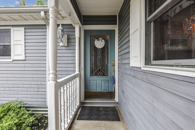 9840 Buckeye Dr, Huntsville, OH 43324 - doorway to property featuring a porch