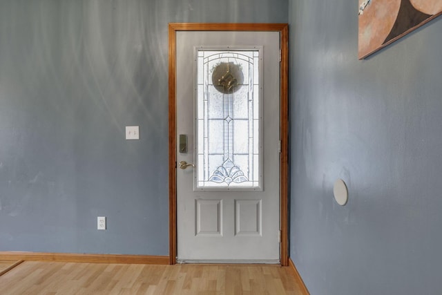 9840 Buckeye Dr, Huntsville, OH 43324 - entrance foyer featuring wood finished floors and baseboards