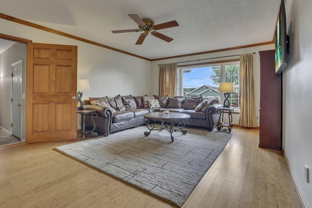 9840 Buckeye Dr, Huntsville, OH 43324 - living room featuring ceiling fan, wood finished floors, ornamental molding, and lofted ceiling