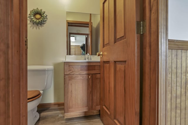 9840 Buckeye Dr, Huntsville, OH 43324 - half bath with vanity and wood finished floors