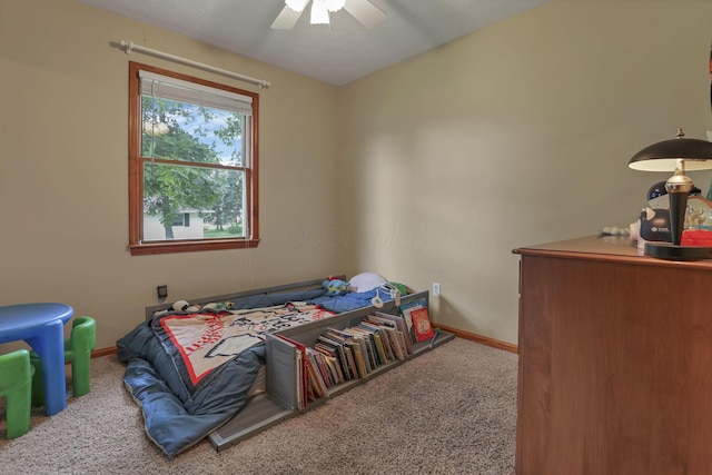 9840 Buckeye Dr, Huntsville, OH 43324 - carpeted bedroom with baseboards and ceiling fan