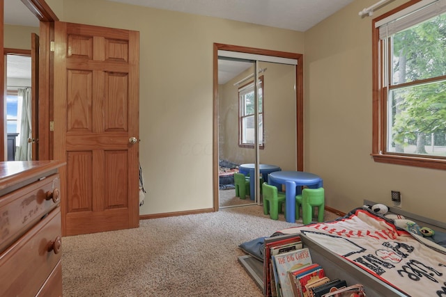 9840 Buckeye Dr, Huntsville, OH 43324 - carpeted bedroom with a closet and baseboards