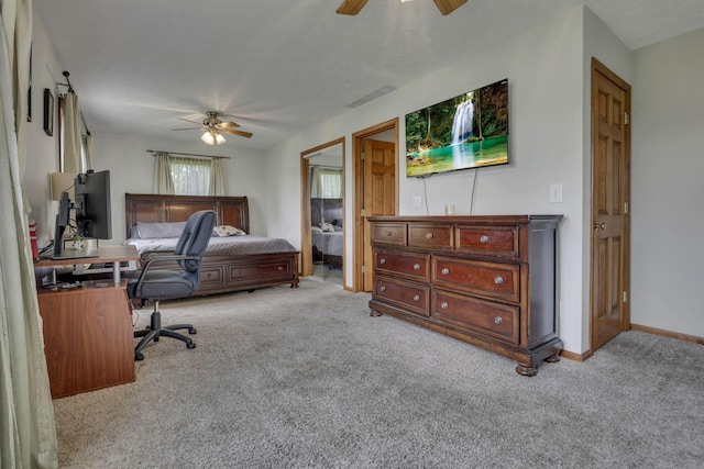 9840 Buckeye Dr, Huntsville, OH 43324 - carpeted bedroom featuring an office area and ceiling fan