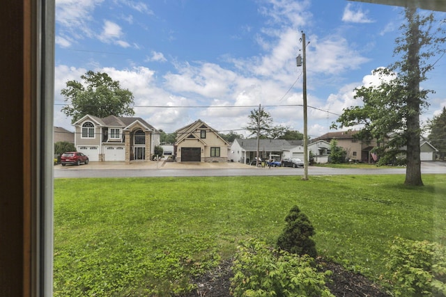 9840 Buckeye Dr, Huntsville, OH 43324 - view of green lawn featuring a residential view