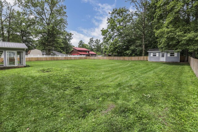 9840 Buckeye Dr, Huntsville, OH 43324 - fenced backyard with a storage shed