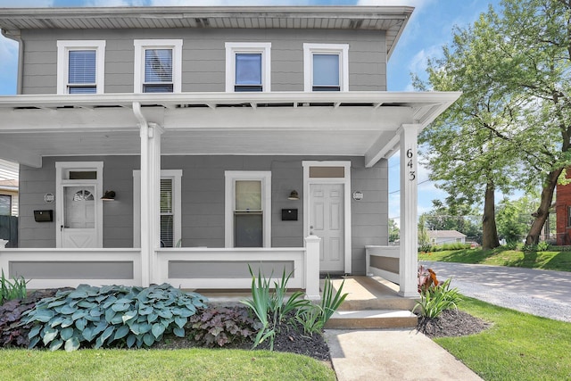 645 E 11th Ave Unit 643, Columbus, OH 43211 - view of front facade featuring covered porch