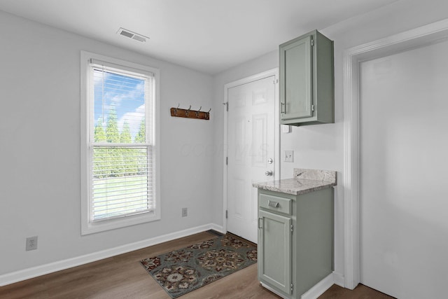 645 E 11th Ave Unit 643, Columbus, OH 43211 - washroom with dark wood-type flooring and baseboards