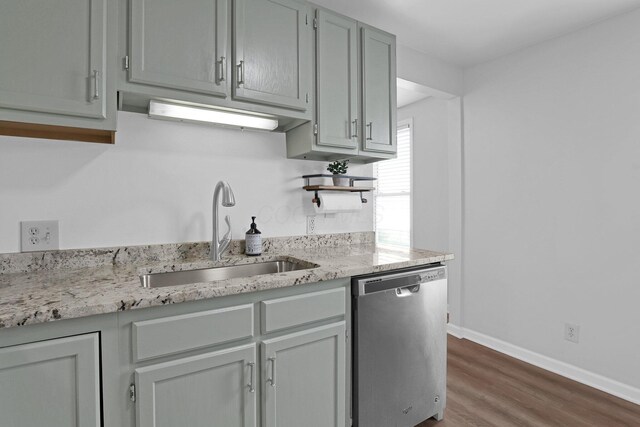 645 E 11th Ave Unit 643, Columbus, OH 43211 - kitchen with dishwasher, wood finished floors, and light stone counters