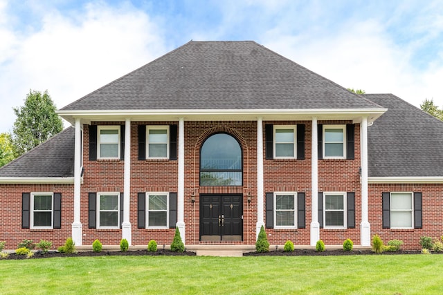9950 Stonemead Way, Dayton, OH 45458 - view of front of house with a shingled roof, brick siding, and a front yard