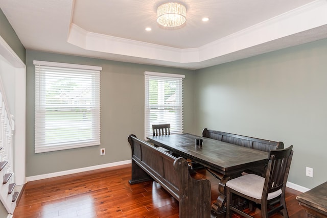 9950 Stonemead Way, Dayton, OH 45458 - dining space with a raised ceiling, dark wood-style flooring, crown molding, recessed lighting, and a chandelier
