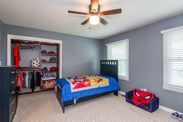 9950 Stonemead Way, Dayton, OH 45458 - bedroom with a closet, light carpet, and a ceiling fan