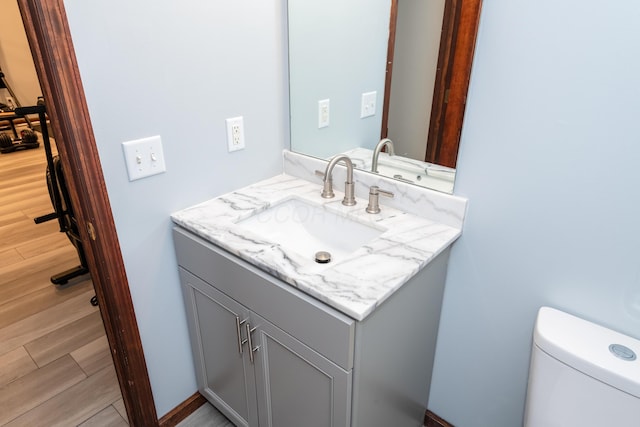 9950 Stonemead Way, Dayton, OH 45458 - half bath featuring vanity and wood finished floors