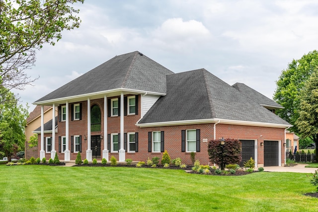 9950 Stonemead Way, Dayton, OH 45458 - greek revival inspired property featuring roof with shingles, an attached garage, brick siding, and a front lawn