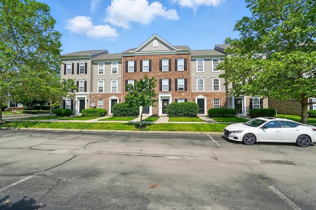 5346 Calypso Cascades Dr, Dublin, OH 43016 - townhome / multi-family property featuring uncovered parking and brick siding
