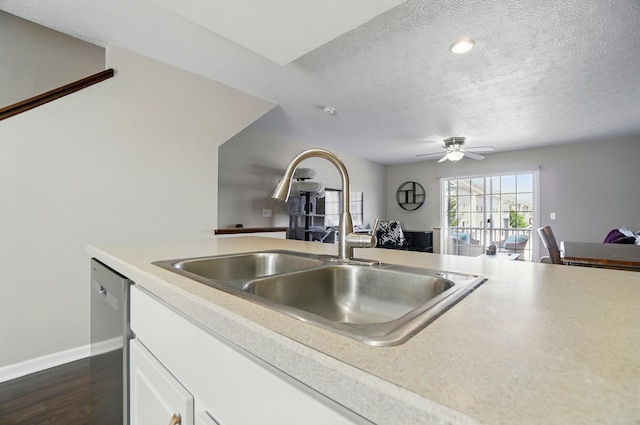 5346 Calypso Cascades Dr, Dublin, OH 43016 - kitchen featuring open floor plan, light countertops, white cabinets, a textured ceiling, and dark wood-style floors