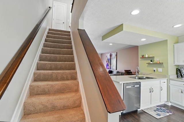 5346 Calypso Cascades Dr, Dublin, OH 43016 - stairs with wood finished floors, recessed lighting, and a textured ceiling