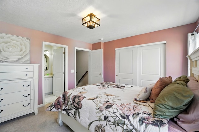 5346 Calypso Cascades Dr, Dublin, OH 43016 - bedroom featuring a closet, light colored carpet, and ensuite bath