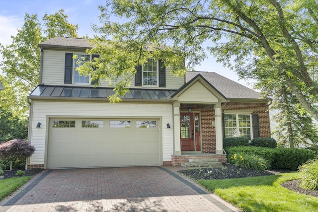7341 Clancy Way, Westerville, OH 43082 - view of front facade with a standing seam roof, decorative driveway, a garage, and a metal roof
