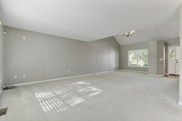 7341 Clancy Way, Westerville, OH 43082 - unfurnished living room featuring light carpet, a chandelier, and lofted ceiling