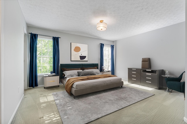 7341 Clancy Way, Westerville, OH 43082 - bedroom with carpet flooring, multiple windows, and a textured ceiling