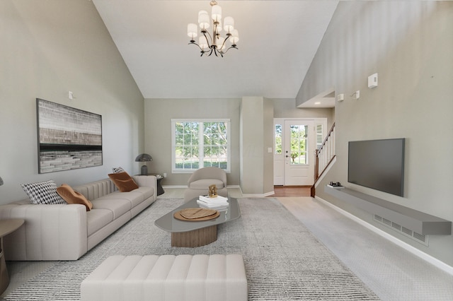 7341 Clancy Way, Westerville, OH 43082 - living room with a chandelier, stairway, high vaulted ceiling, and carpet flooring