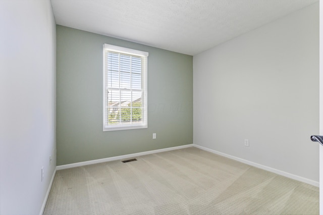 7341 Clancy Way, Westerville, OH 43082 - spare room featuring light colored carpet and a textured ceiling