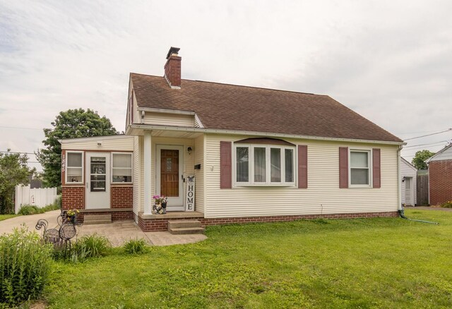 1845 N Columbus St, Lancaster, OH 43130 - view of front of property with a chimney, a front lawn, and a shingled roof