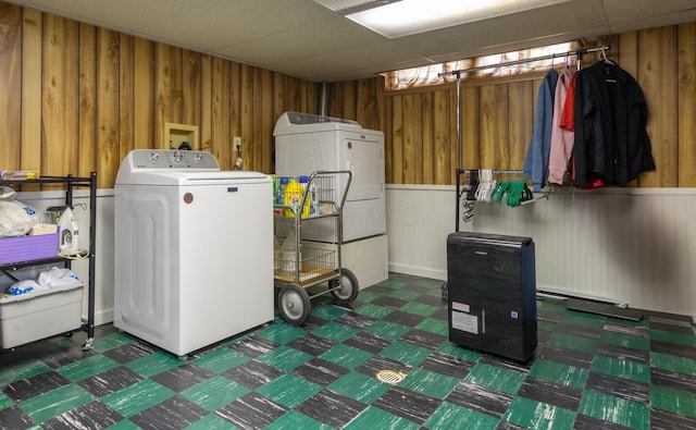 1845 N Columbus St, Lancaster, OH 43130 - laundry room with wooden walls, washing machine and clothes dryer, and a wainscoted wall