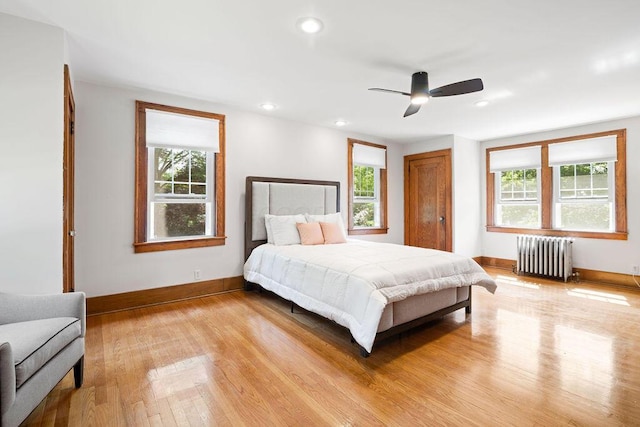 405 N Union St, Galion, OH 44833 - bedroom with radiator, light wood-style flooring, recessed lighting, and ceiling fan