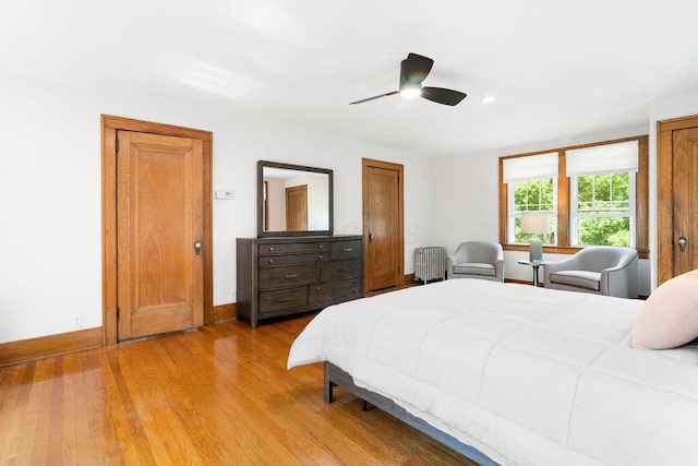 405 N Union St, Galion, OH 44833 - bedroom featuring radiator, light wood-style floors, and a ceiling fan