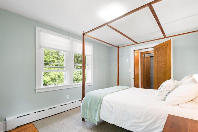 405 N Union St, Galion, OH 44833 - bedroom with a baseboard heating unit and wood finished floors
