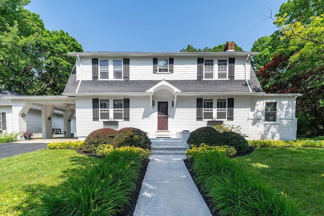 405 N Union St, Galion, OH 44833 - view of front of property with a front yard and a chimney