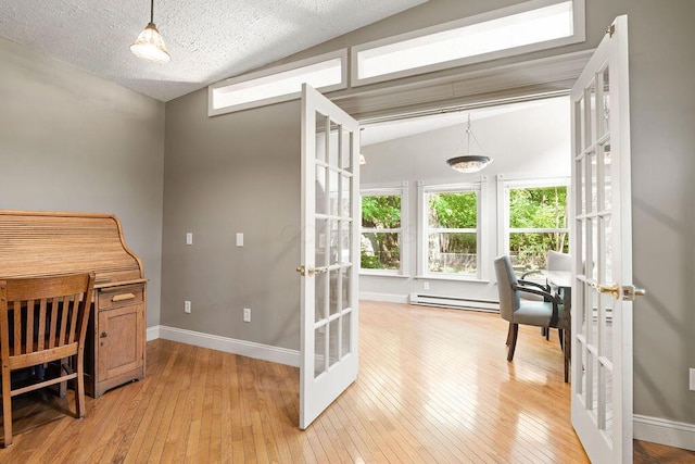 405 N Union St, Galion, OH 44833 - office featuring french doors, a baseboard radiator, light wood-type flooring, and lofted ceiling