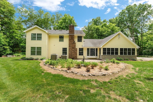 4563 Donithen Rd, Marion, OH 43302 - rear view of property featuring a chimney, a lawn, a patio area, and roof with shingles