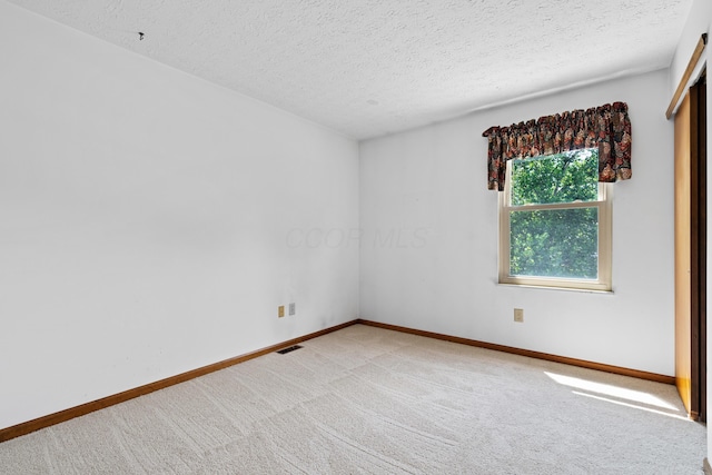 9 Intermeadows Way, Powell, OH 43065 - carpeted empty room with a textured ceiling and baseboards
