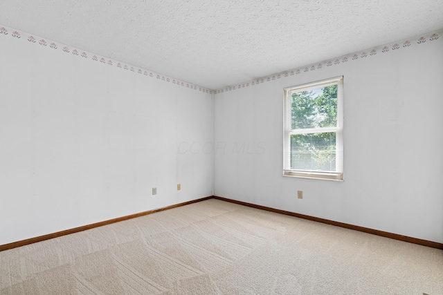 9 Intermeadows Way, Powell, OH 43065 - empty room featuring a textured ceiling and light colored carpet