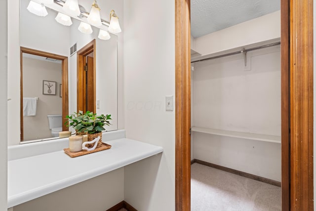 9 Intermeadows Way, Powell, OH 43065 - bathroom with a textured ceiling and vanity