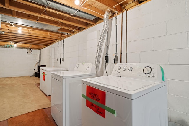 9 Intermeadows Way, Powell, OH 43065 - laundry area with independent washer and dryer, light carpet, and concrete block wall