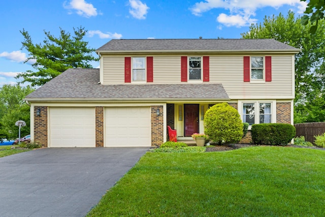 9 Intermeadows Way, Powell, OH 43065 - view of front of house featuring driveway, brick siding, and roof with shingles