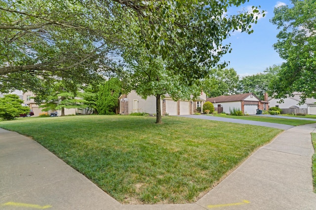 9 Intermeadows Way, Powell, OH 43065 - view of front of house with a front yard, a garage, and driveway