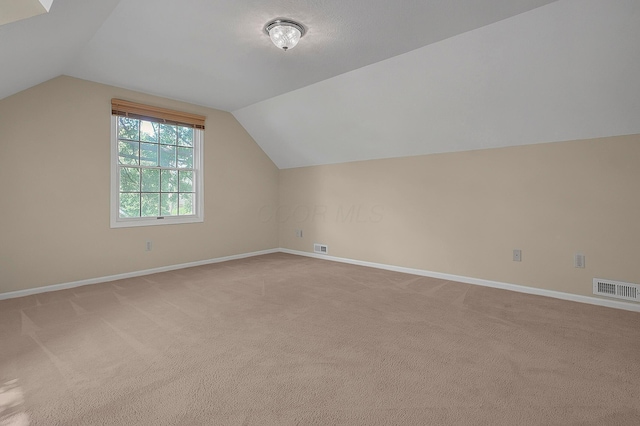 764 Towne Krier Ct, Newark, OH 43055 - additional living space featuring lofted ceiling and light colored carpet
