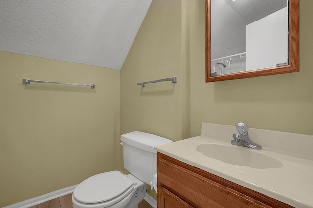 764 Towne Krier Ct, Newark, OH 43055 - bathroom with vanity, vaulted ceiling, wood finished floors, and a textured ceiling