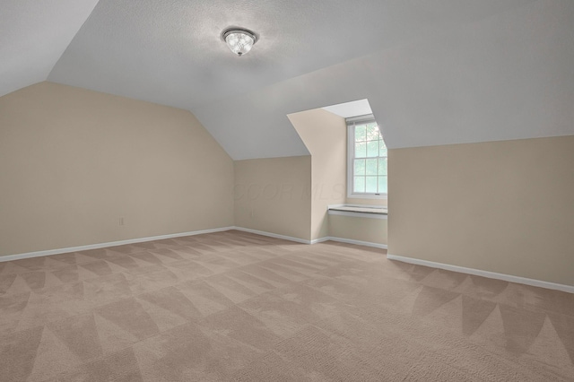 764 Towne Krier Ct, Newark, OH 43055 - bonus room featuring vaulted ceiling, light colored carpet, and a textured ceiling